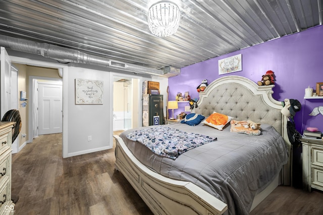 5730 S 50 W, Trafalgar, IN 46181 - bedroom featuring dark wood finished floors, baseboards, and ensuite bath