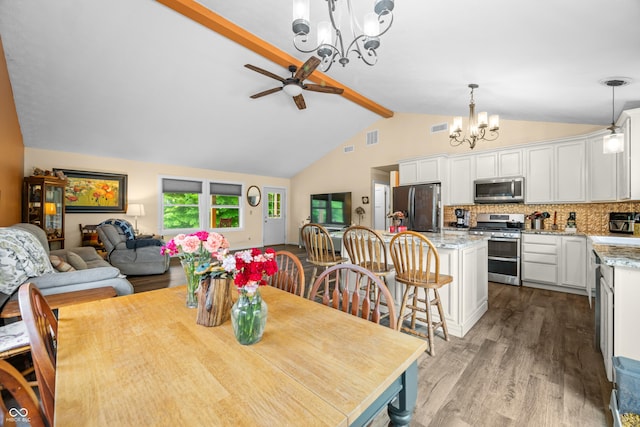 5730 S 50 W, Trafalgar, IN 46181 - dining space with a chandelier, wood finished floors, beamed ceiling, a ceiling fan, and high vaulted ceiling