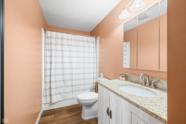 5730 S 50 W, Trafalgar, IN 46181 - full bath featuring vanity, wood finished floors, toilet, and shower / bathtub combination with curtain