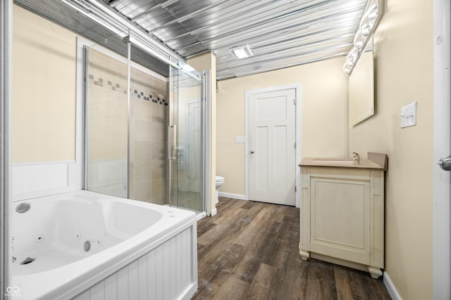 5730 S 50 W, Trafalgar, IN 46181 - bathroom with a tub with jets, toilet, wood finished floors, and a tile shower