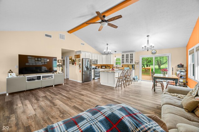 5730 S 50 W, Trafalgar, IN 46181 - living area with a chandelier, ceiling fan, light wood-type flooring, and baseboards