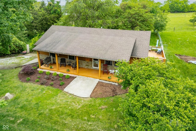 5730 S 50 W, Trafalgar, IN 46181 - view of front of property with covered porch, a deck, outdoor dining space, and a shingled roof