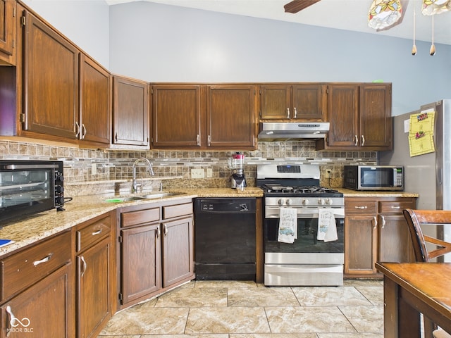 3223 Keystone Lakes Way, Indianapolis, IN 46237 - kitchen with appliances with stainless steel finishes, under cabinet range hood, a sink, decorative backsplash, and vaulted ceiling