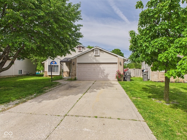 3223 Keystone Lakes Way, Indianapolis, IN 46237 - obstructed view of property with brick siding, an attached garage, and concrete driveway