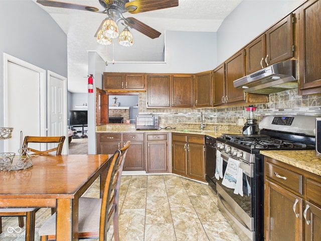 3223 Keystone Lakes Way, Indianapolis, IN 46237 - kitchen with stainless steel gas stove, under cabinet range hood, a ceiling fan, and backsplash
