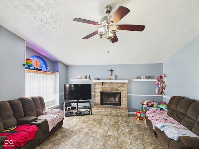 3223 Keystone Lakes Way, Indianapolis, IN 46237 - living area featuring vaulted ceiling, a textured ceiling, ceiling fan, and a brick fireplace