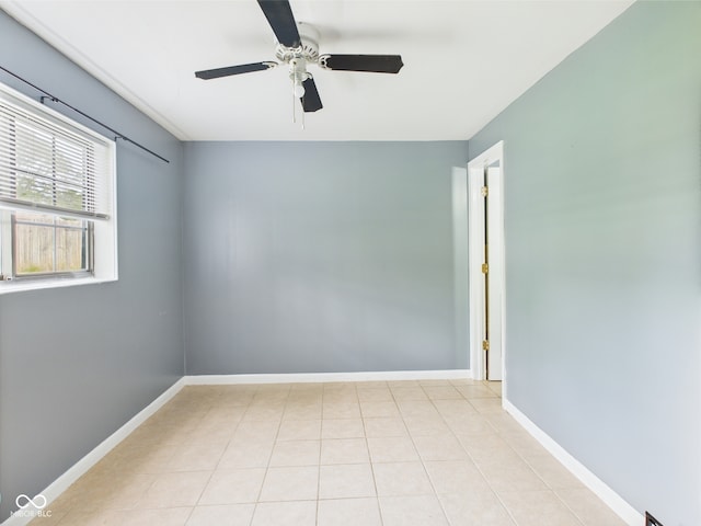 3223 Keystone Lakes Way, Indianapolis, IN 46237 - empty room with a ceiling fan, light tile patterned flooring, and baseboards
