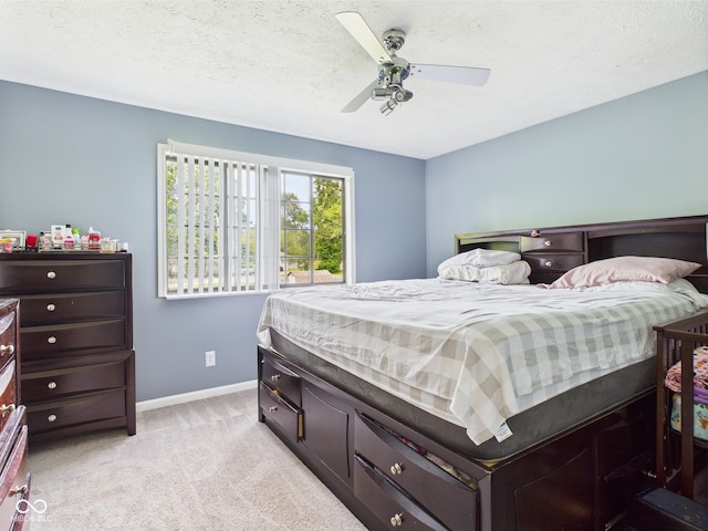 3223 Keystone Lakes Way, Indianapolis, IN 46237 - bedroom with light carpet, baseboards, a ceiling fan, and a textured ceiling
