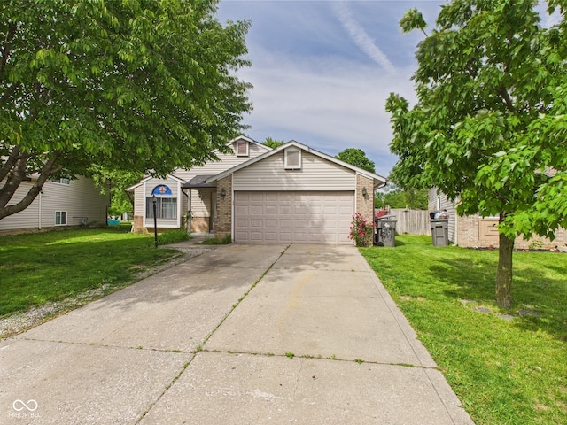 3223 Keystone Lakes Way, Indianapolis, IN 46237 - obstructed view of property featuring brick siding, a garage, concrete driveway, and a front lawn