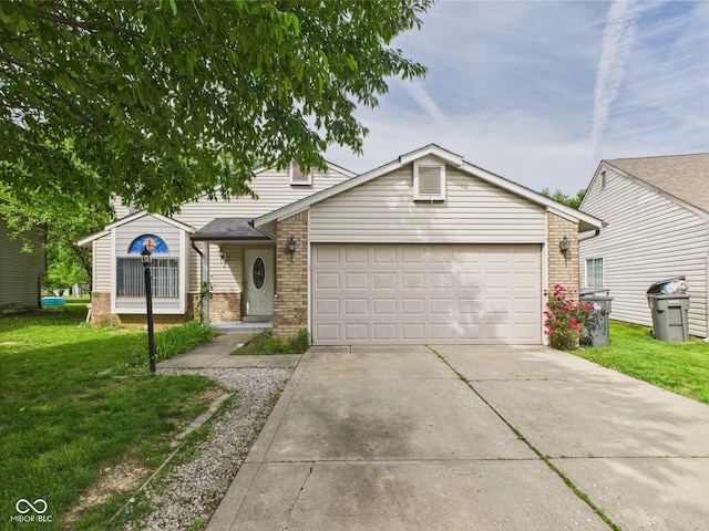 3223 Keystone Lakes Way, Indianapolis, IN 46237 - view of front facade with brick siding, driveway, a front lawn, and a garage