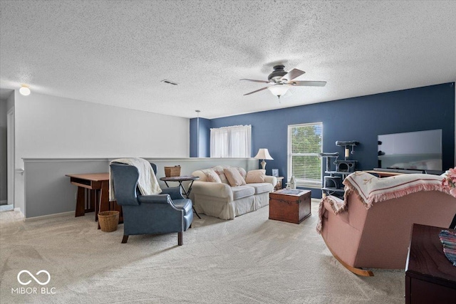 12624 Majestic Way, Fishers, IN 46037 - living room featuring carpet flooring, ceiling fan, and a textured ceiling