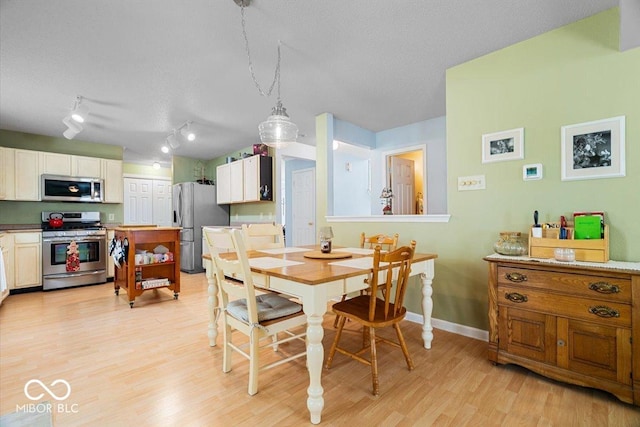 12624 Majestic Way, Fishers, IN 46037 - dining area featuring light wood-style floors and baseboards
