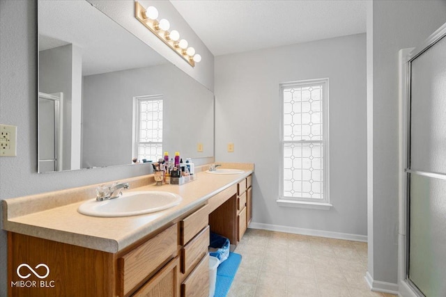 12624 Majestic Way, Fishers, IN 46037 - full bathroom with double vanity, an enclosed shower, tile patterned floors, and baseboards