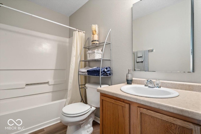 12624 Majestic Way, Fishers, IN 46037 - full bath featuring vanity, wood finished floors, shower / bath combo, toilet, and a textured ceiling