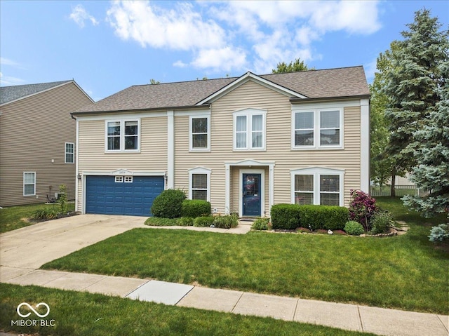 12624 Majestic Way, Fishers, IN 46037 - colonial house featuring a garage, concrete driveway, a front lawn, and a shingled roof