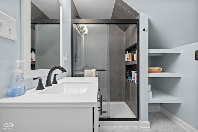 2645 Washington St, Columbus, IN 47201 - bathroom with marble look tile flooring, a shower stall, vanity, and baseboards