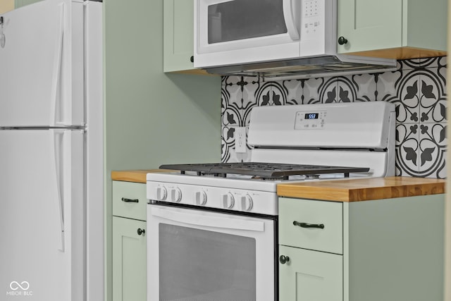 2645 Washington St, Columbus, IN 47201 - kitchen with white appliances, butcher block counters, and backsplash