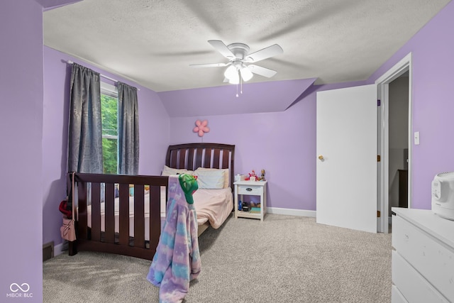 2645 Washington St, Columbus, IN 47201 - bedroom with a textured ceiling, carpet, ceiling fan, and baseboards