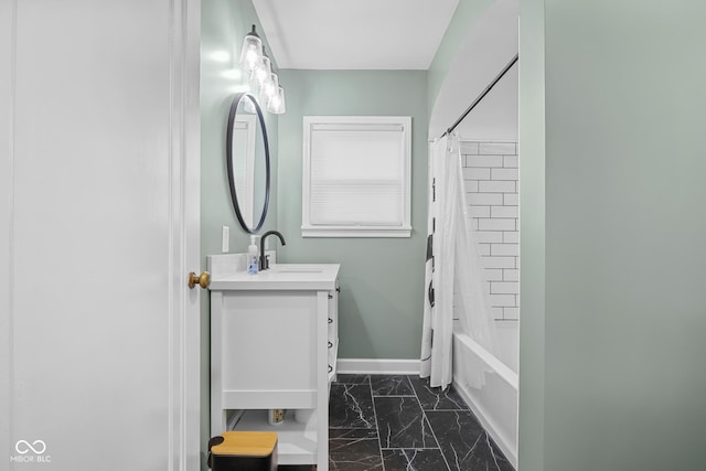 2645 Washington St, Columbus, IN 47201 - bathroom with vanity, marble look tiles, baseboards, and shower / tub combo with curtain