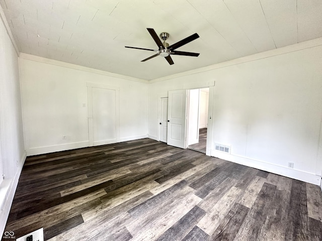 106 S Hancock St, Waynetown, IN 47990 - unfurnished bedroom featuring dark wood finished floors, baseboards, and a ceiling fan