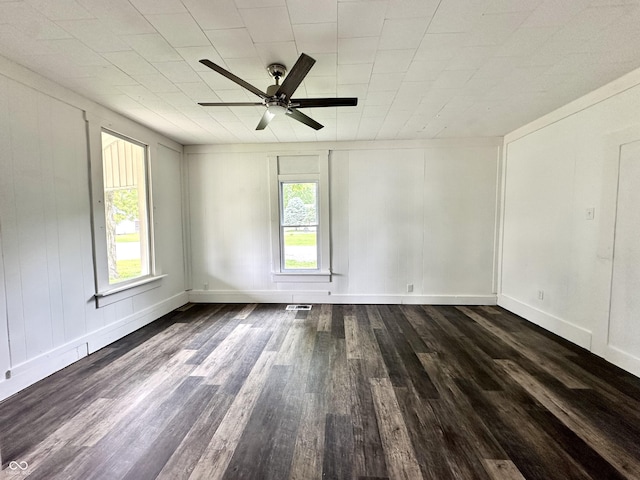 106 S Hancock St, Waynetown, IN 47990 - empty room with healthy amount of natural light, dark wood finished floors, ceiling fan, and baseboards
