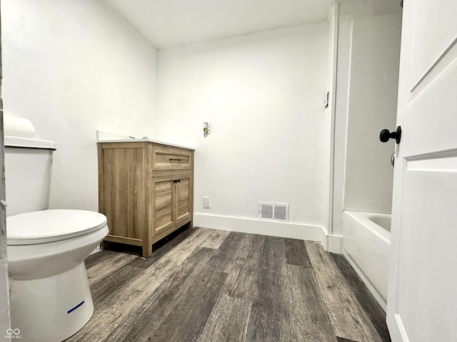 106 S Hancock St, Waynetown, IN 47990 - bathroom featuring wood finished floors, toilet, vanity, and baseboards