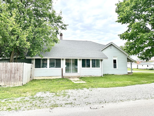106 S Hancock St, Waynetown, IN 47990 - rear view of house with roof with shingles and a chimney