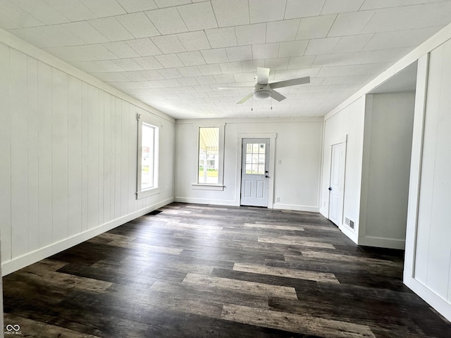 106 S Hancock St, Waynetown, IN 47990 - spare room with dark wood-style flooring, a ceiling fan, and baseboards