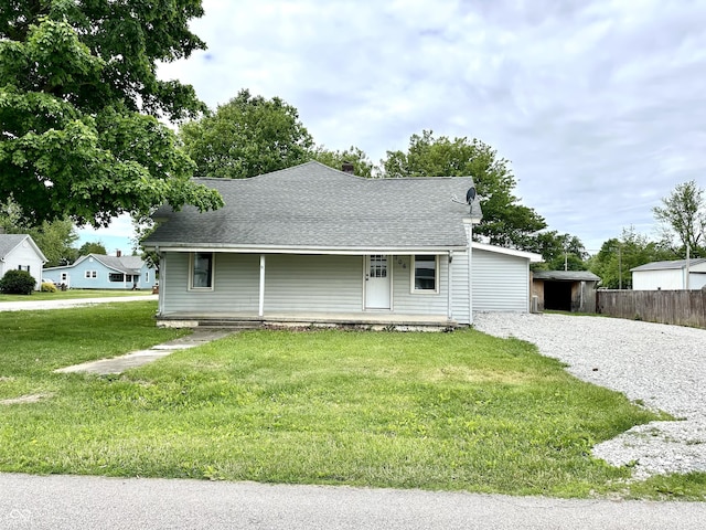 106 S Hancock St, Waynetown, IN 47990 - view of front facade featuring a porch, gravel driveway, and a shingled roof