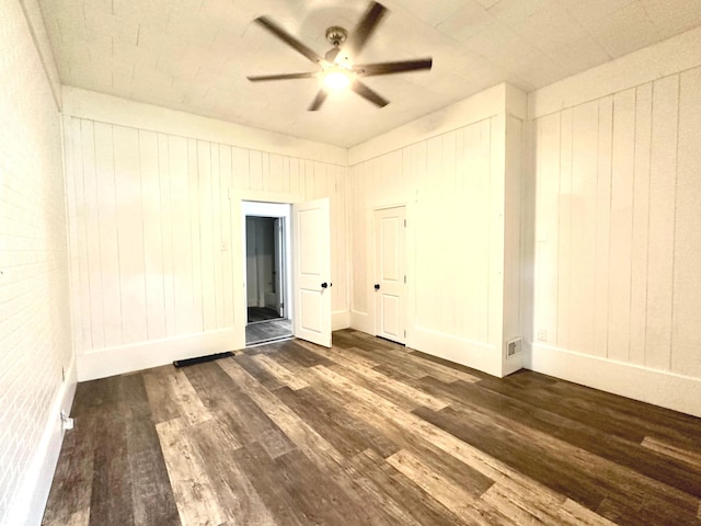 106 S Hancock St, Waynetown, IN 47990 - empty room featuring dark wood finished floors, a ceiling fan, and baseboards