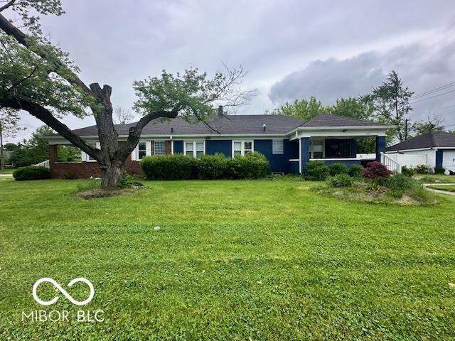 5147 E 16th St, Indianapolis, IN 46218 - single story home featuring a front yard