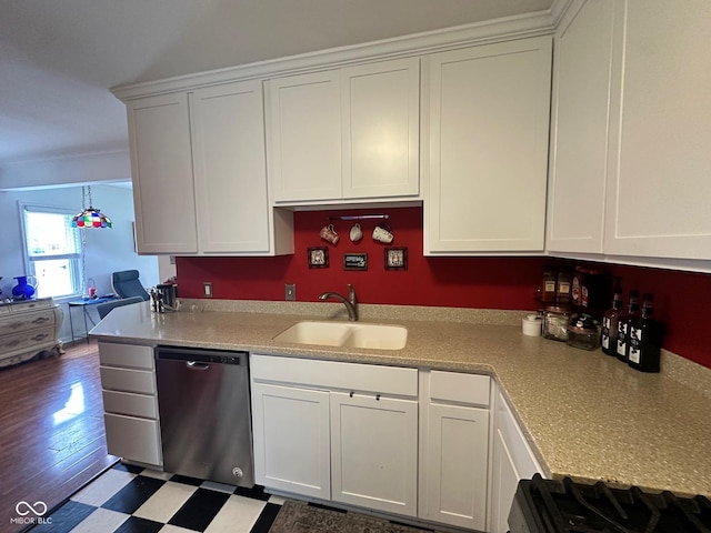 5147 E 16th St, Indianapolis, IN 46218 - kitchen with dishwasher, a sink, white cabinets, and light countertops