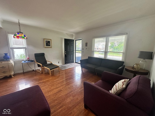 5147 E 16th St, Indianapolis, IN 46218 - living area with healthy amount of natural light, wood finished floors, and crown molding