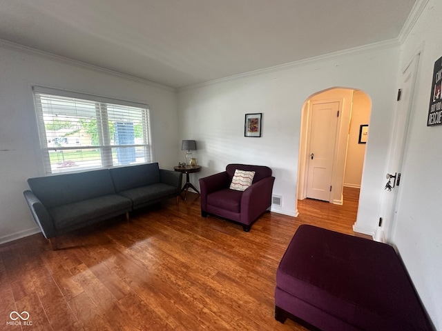 5147 E 16th St, Indianapolis, IN 46218 - living room with arched walkways, crown molding, wood finished floors, and baseboards