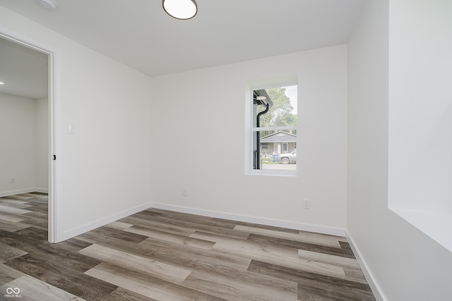 2631 Collier St, Indianapolis, IN 46241 - spare room featuring wood finished floors and baseboards