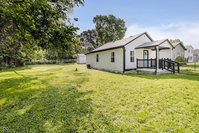 2631 Collier St, Indianapolis, IN 46241 - view of side of property with a yard and a shingled roof