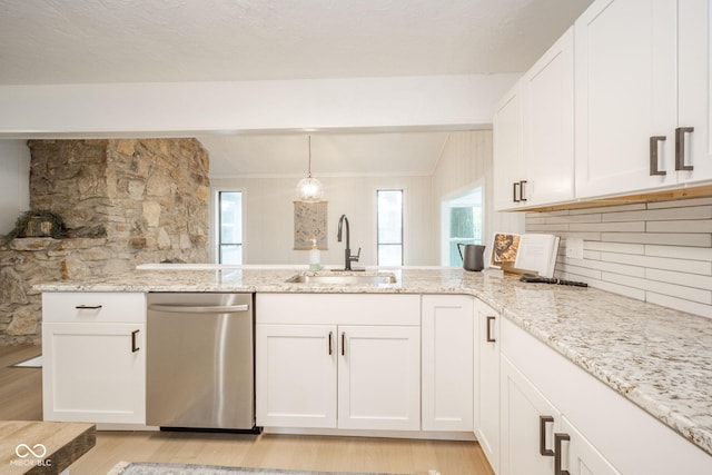 1127 Hickory Ln, New Castle, IN 47362 - kitchen with stainless steel dishwasher, a sink, light wood finished floors, a peninsula, and light stone countertops