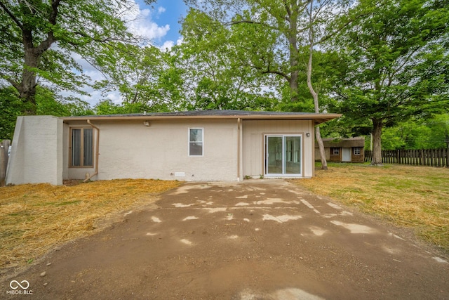 1127 Hickory Ln, New Castle, IN 47362 - rear view of property featuring stucco siding and a patio