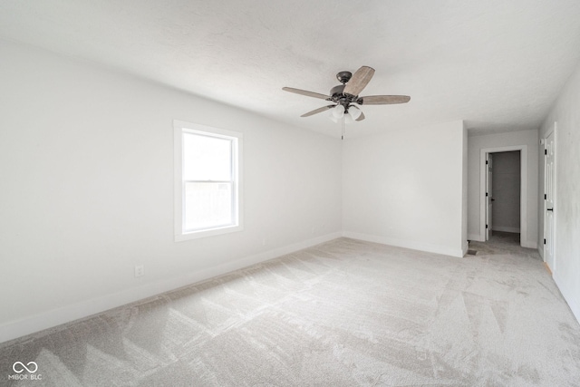 1127 Hickory Ln, New Castle, IN 47362 - unfurnished room with light colored carpet, ceiling fan, and baseboards