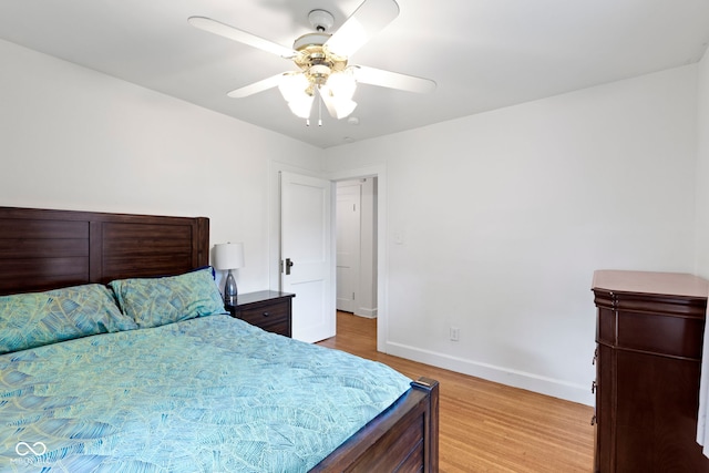 5259 Broadway St, Indianapolis, IN 46220 - bedroom with light wood finished floors, baseboards, and a ceiling fan