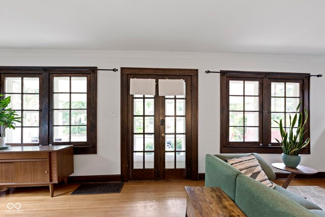 5259 Broadway St, Indianapolis, IN 46220 - doorway to outside with french doors, wood finished floors, plenty of natural light, and baseboards