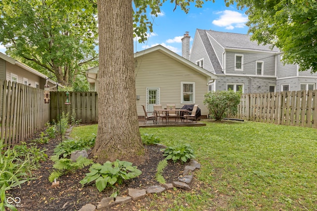 5259 Broadway St, Indianapolis, IN 46220 - back of property with a chimney, roof with shingles, and a patio area