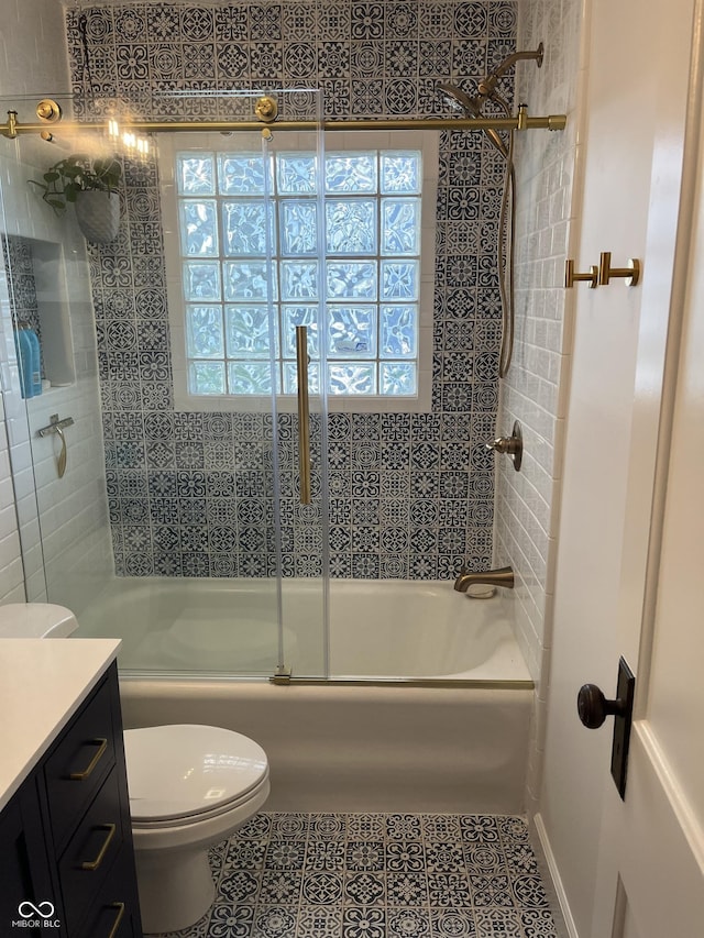 5259 Broadway St, Indianapolis, IN 46220 - full bathroom featuring vanity, shower / bath combination with glass door, toilet, and tile patterned floors