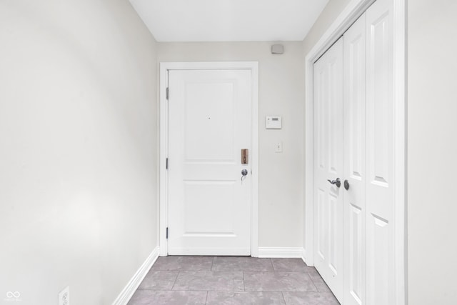 350 N Meridian St Unit 705, Indianapolis, IN 46204 - entryway with baseboards and light tile patterned floors