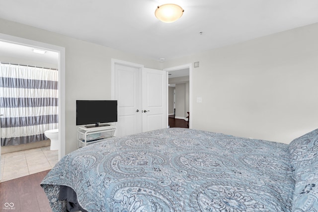 350 N Meridian St Unit 705, Indianapolis, IN 46204 - bedroom with wood finished floors and ensuite bath