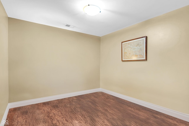 350 N Meridian St Unit 705, Indianapolis, IN 46204 - empty room with baseboards and dark wood-style floors