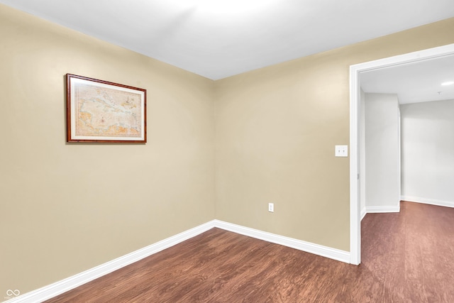 350 N Meridian St Unit 705, Indianapolis, IN 46204 - spare room featuring dark wood-style flooring and baseboards