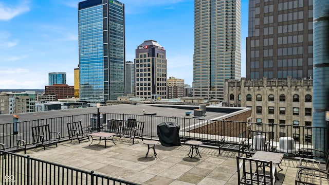 350 N Meridian St Unit 705, Indianapolis, IN 46204 - view of patio / terrace with a skyline view and area for grilling