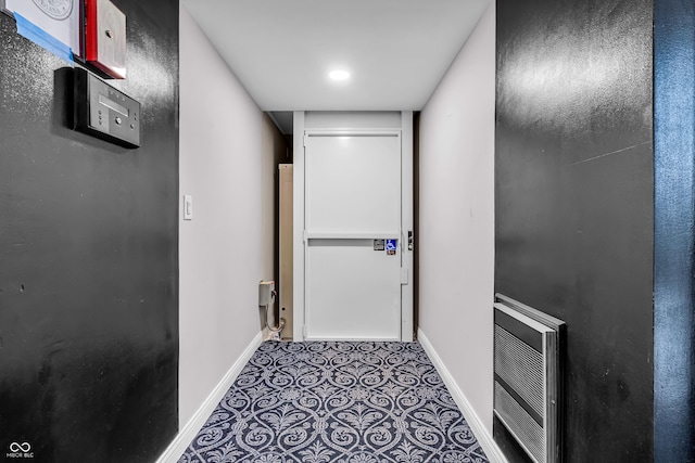 350 N Meridian St Unit 705, Indianapolis, IN 46204 - hall with baseboards and heating unit