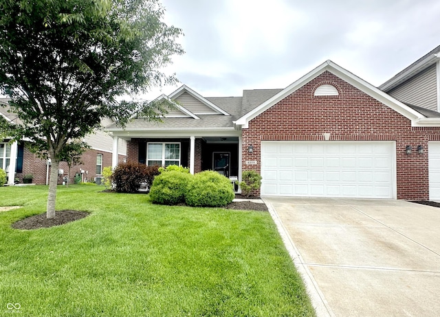 4209 Switchgrass Way, Indianapolis, IN 46237 - view of front facade with brick siding, a garage, a front lawn, and concrete driveway